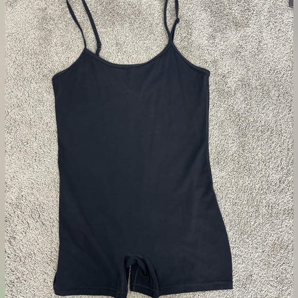 TNA Tops - Tnaction black aritzia‎ life divinity 5” romper